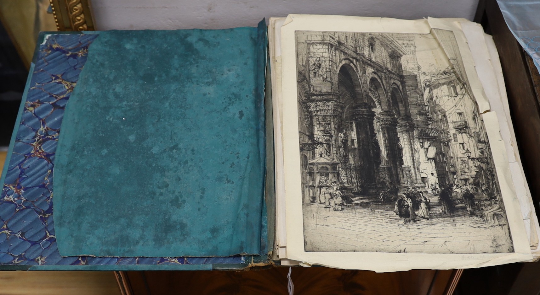 G. Borelli of Rome. A folio of photographs of antiquities and historical artefacts, together with an etching by Hedley Fitton, overall 49 x 38cm